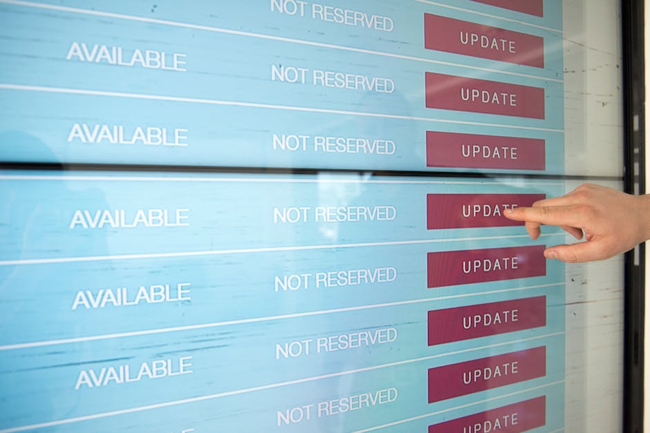 A close-up image of a computer screen displaying lines of colorful programming code, with text in shades of green, pink, blue, and white on a dark background. The code appears to be JavaScript or simi